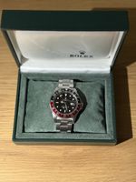 Montre Rolex GMT-Master « Coke » lunette noire/rouge 